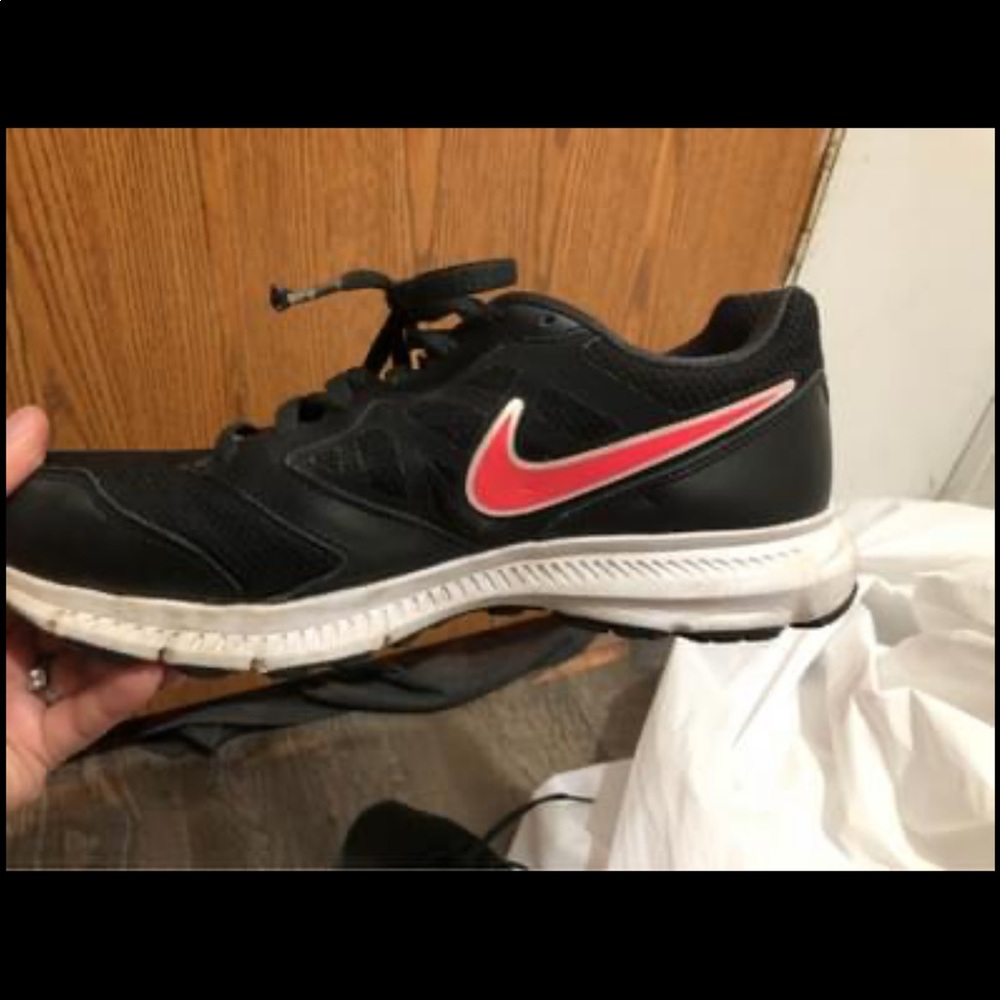 Pink and black Nike shoes